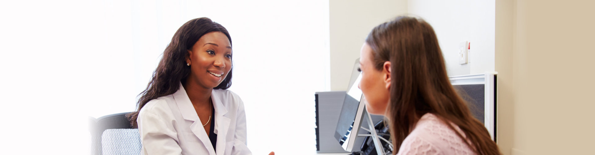 doctor smiling at patient in the clinic